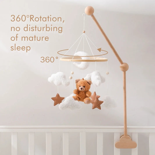 Wooden baby crib mobile with bell and hanging bracket.